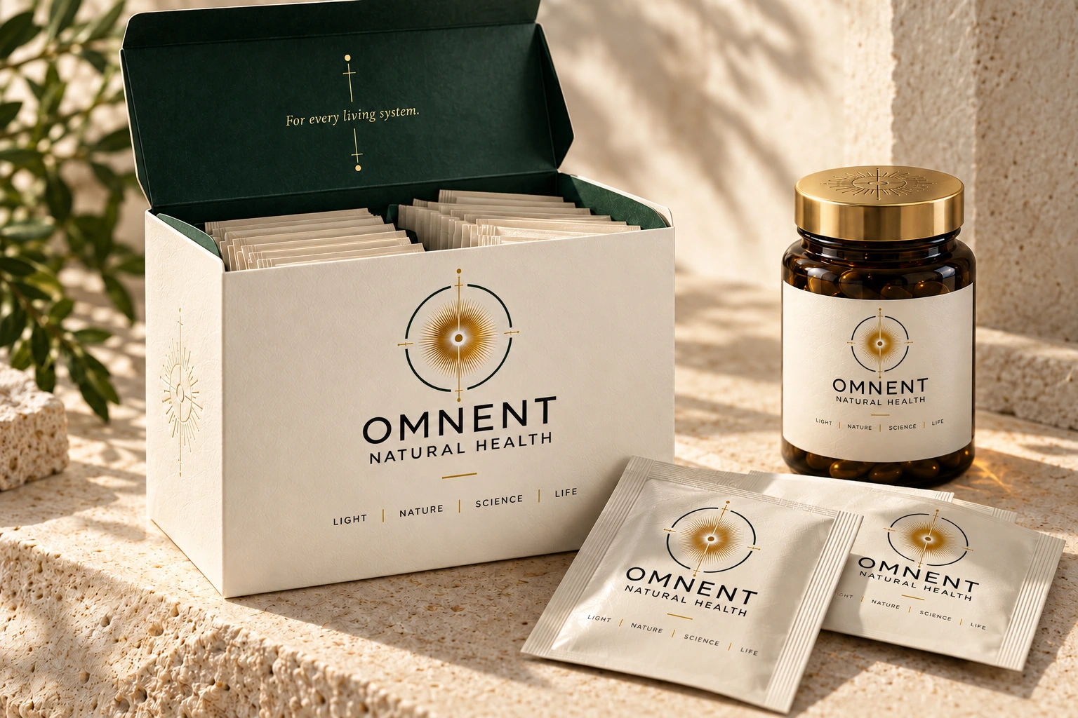 OMNENT presentation box, sachets and amber glass jar in warm daylight.